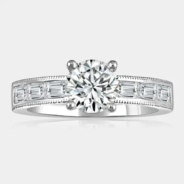 0.83 carat round brilliant cut diamond engagement ring in 18ct white gold with baguette cut shoulder diamonds.
