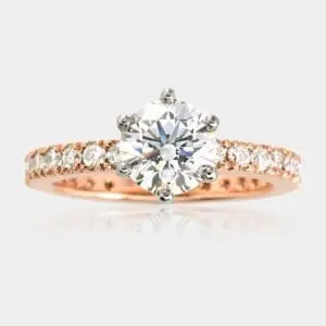 Diamond engagement ring, with white gold six-claw setting and 18ct rose gold band, fully set with round brilliant cut diamonds all the way around.