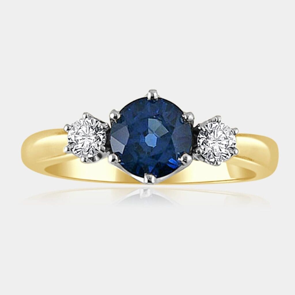 3 stone Blue sapphire and diamond ring with 18ct white gold setting and yellow gold band.