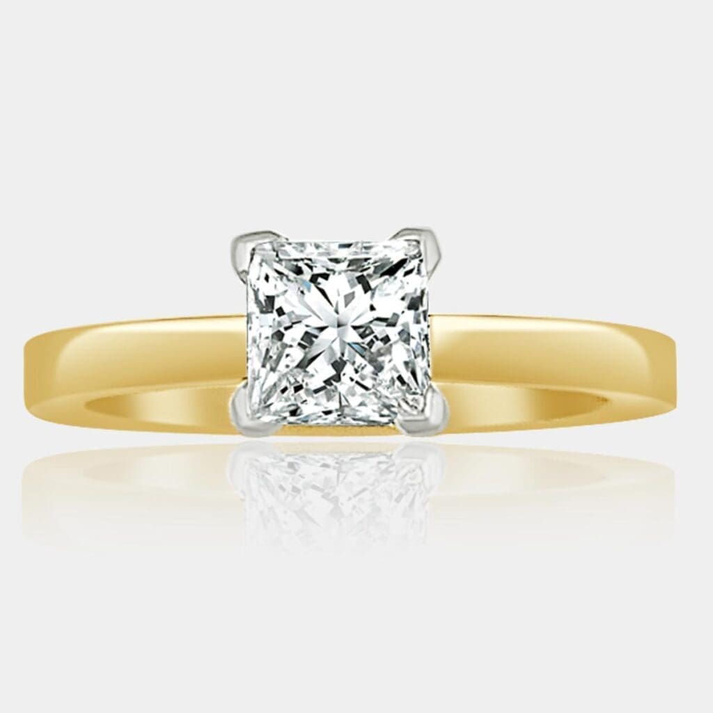 Handmade princess cut diamond engagement ring with 18ct white gold V-claw setting and 18ct yellow gold band.