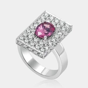 Handmade, contemporary design engagement ring fearuring cushion cut pink sapphire and diamonds in pave style, table settiing in 18ct white gold.