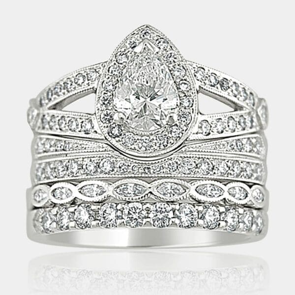 Marquise cut diamond engagement ring with full set of rings on the side.