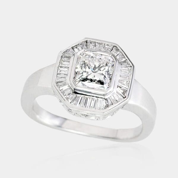 Handmade, art deco style ring with halo of baguette cut diamonds and hand-pierced octagol shape setting.