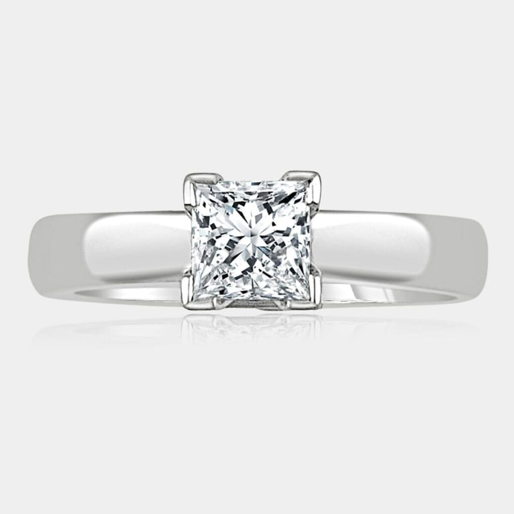 1.00 carat Princess cut solitaire diamond ring with v-claw setting in 18ct white gold.