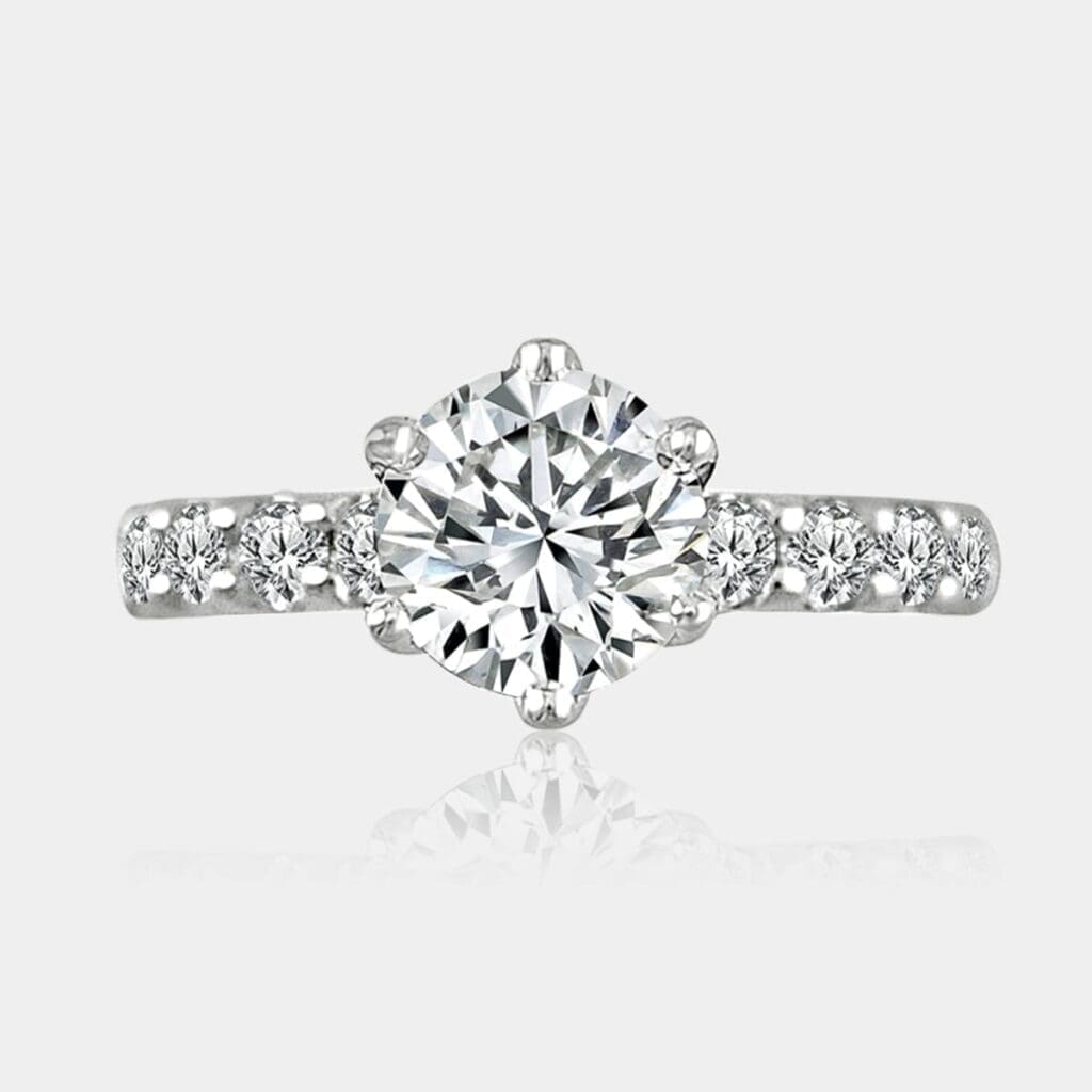 Round brilliant cut diamond ring with shoulder diamonds totaling 1.60 carat.