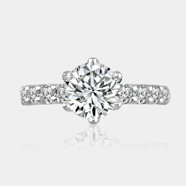 Round brilliant cut diamond ring with shoulder diamonds totaling 1.60 carat.