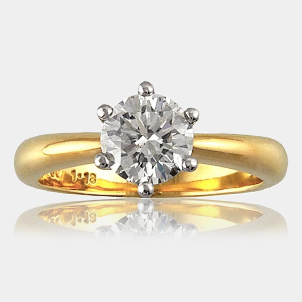1.10 carat Solitaire diamond ring with six claw setting in white gold and tapered 18ct yellow gold band.