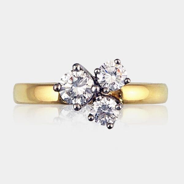3 stone round brilliant cut diamond ring in white and yellow gold with a total of 1.00ct of diamonds