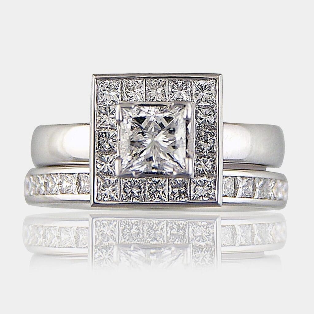 Princess cut diamond cluster engagement ring and wedding ring set.