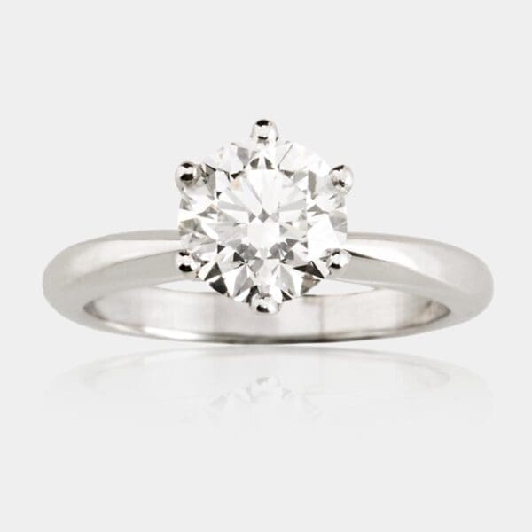 Solitaire diamond engagement ring, 18ct white gold with six claw setting and tapered band with rounded profile.