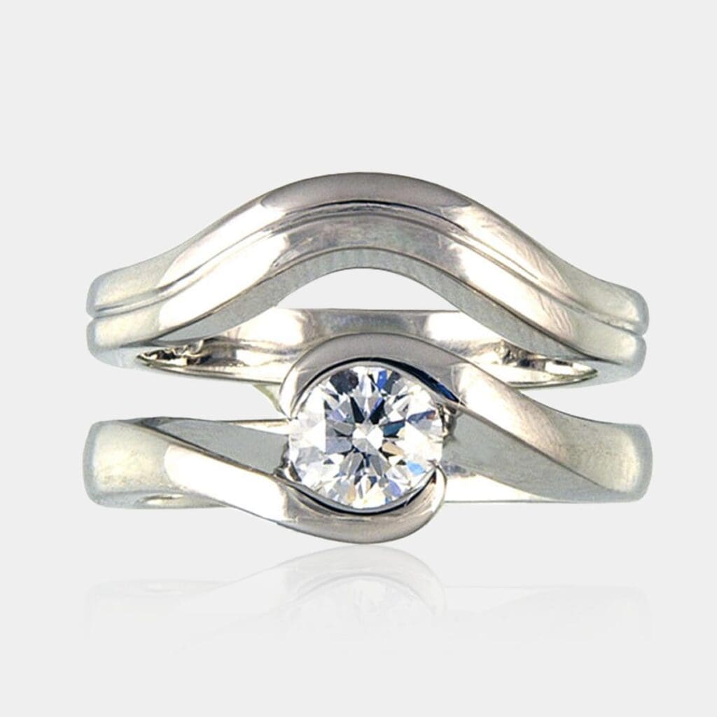 0.80 carat Round diamond cross over design ring with matching wedding band.