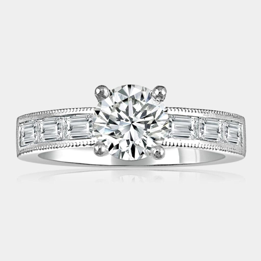 0.83 carat round brilliant cut diamond engagement ring in 18ct white gold with baguette cut shoulder diamonds.