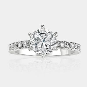 Diamond engagement ring with six-claw setting and round brilliant cut diamonds share claw set in 18ct white gold band.