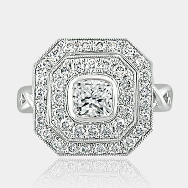 0.80 carat Cushion cut diamond ring with 2 rows of surround diamonds and custom designed band.