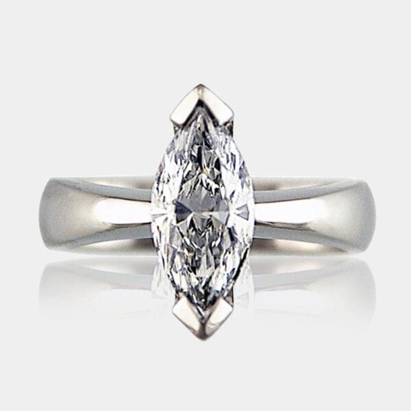 Large marquise diamond ring set in platinum with tapered band.