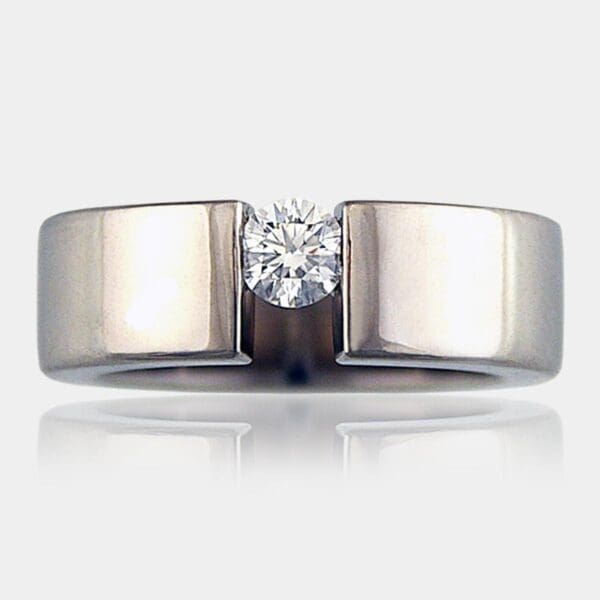 Round brilliant cut diamond in a solid palladium ring.