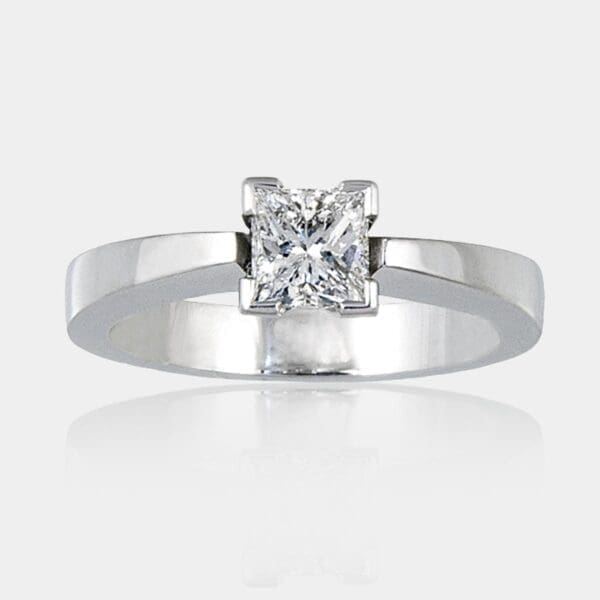 0.60 carat Princess cut diamond ring with a flat tapered 18ct white gold band.