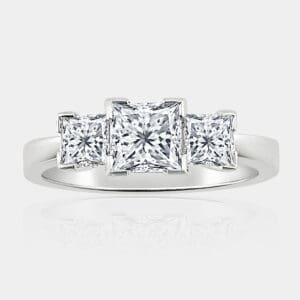 3 stone princess cut diamond ring with picture-frame setting in 18ct white gold.