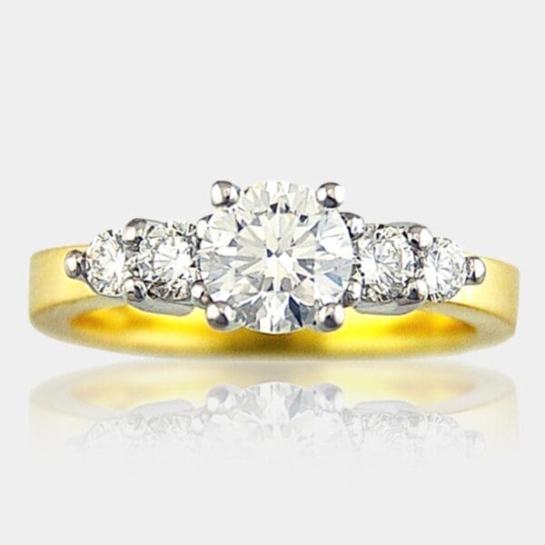 5 stone round brilliant cut diamond ring in 18ct white settings and yellow gold band.