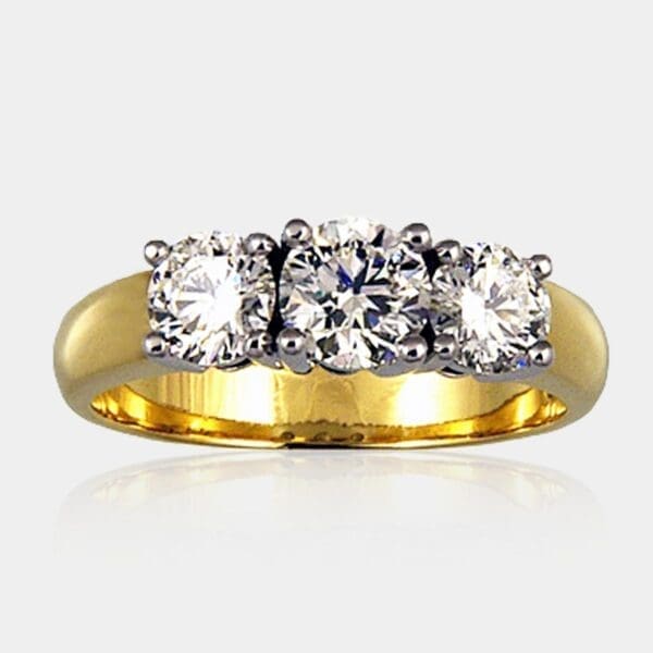 Three 3 stone ring featuring 1x 0.75 carat and 2x 0.50 carat diamonds in 18ct white gold setting with 18ct yellow gold band.