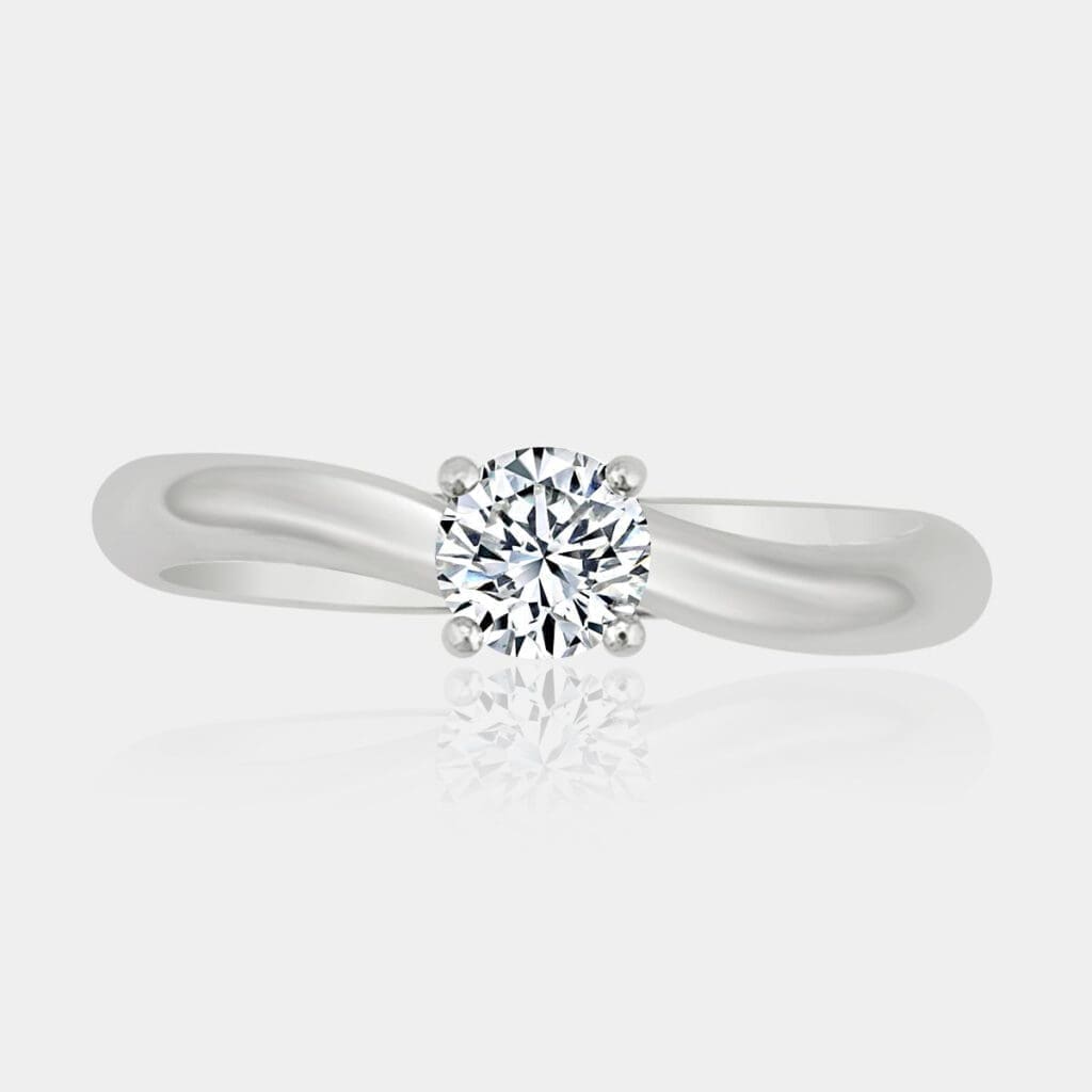 Handmade round brilliant cut solitaire diamond engagement ring with twised 18ct white gold band.