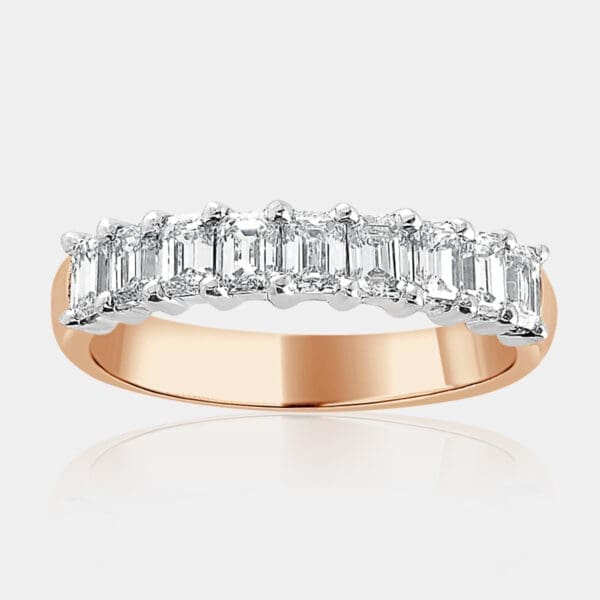 Hand-made, 18ct Yellow Gold Ring With White Gold Setting Featuring Nine Emerald Cut Diamonds.