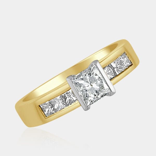 0.90 carat Princess cut diamond ring, 18ct white gold with semi-bezel setting and 18ct yellow gold band channel set with princess cut diamonds.