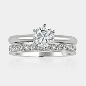 0.74 carat Round brilliant cut engagement ring with matching diamond wedding ring.