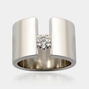 0.40ct round brilliant cut diamond ring tension set in 16mm wide 18ct gold band.