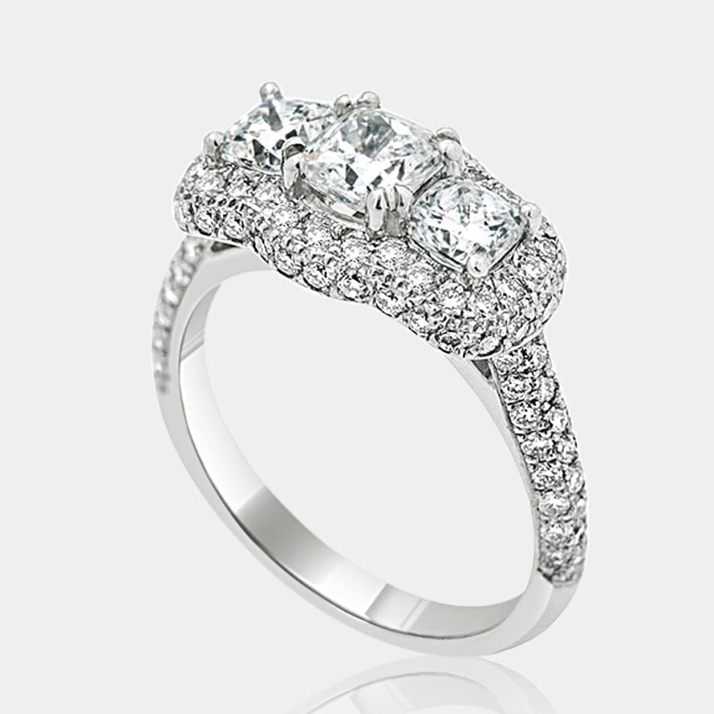 Handmade, designer style ring with cushion cut diamonds surrounded by round diamonds and double row of diamonds in the band.