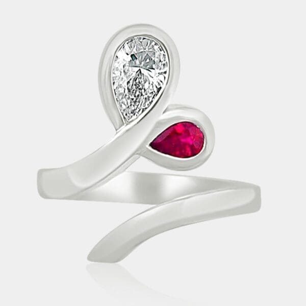 Pear shape diamond & ruby ring in a leaf/petal design.