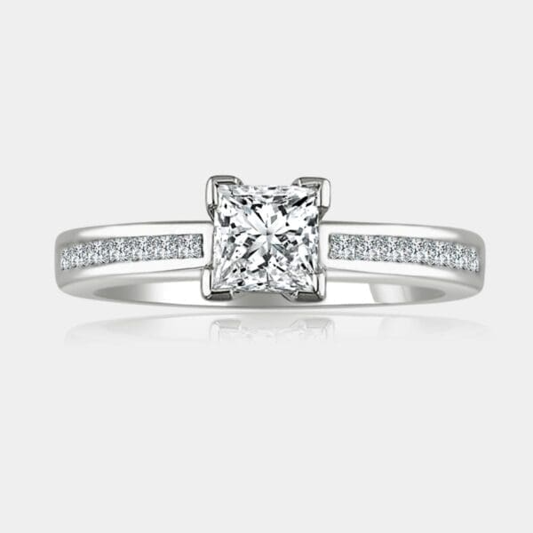 Princess cut diamond engagement ring with tapering shoulder diamonds.