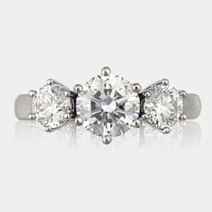 3 stone round brilliant cut diamond ring with 1.2 carat centre and 0.40 carat stones on each side, set in a handmade 18ct white gold ring.
