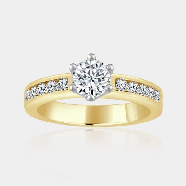 0.60 carat Round brilliant cut diamond ring with channel set shoulder diamonds.